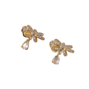 Elegant gold bow earrings with shimmering zircon pave and clear teardrop crystal drops