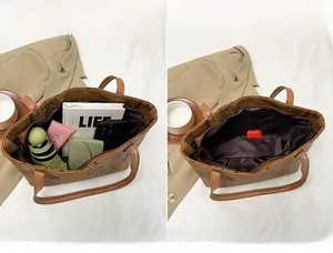 Detailed interior of large tote bag showing high capacity for umbrella and notebook