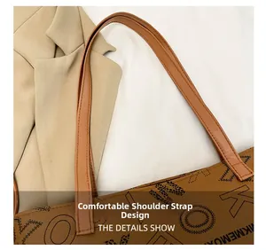 Detail shot of comfort shoulder strap on brown printed tote bag with precise stitching