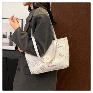 Litchi texture faux leather tote bag with MKMEMOXI letters shown on model side view