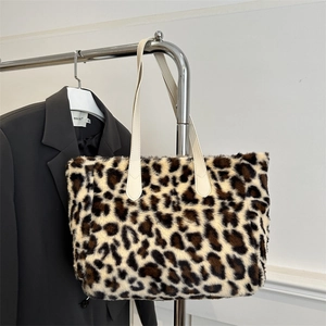 Fashionable leopard print faux fur tote bag with cream leather handles for daily use