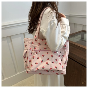 Pink corduroy strawberry print tote bag for women featuring multiple pockets and soft texture
