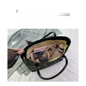 Detailed interior of a large butterfly print tote bag showing spacious storage capacity