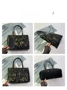 Multi-angle views of large jacquard tote bag with golden butterfly print and phone for scale