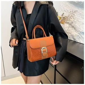 Brown leather crossbody bag with crocodile texture and metal D-buckle closure for women