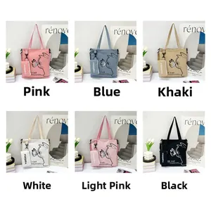 Detailed grid view of six colored canvas tote bags with cat prints and matching pouches