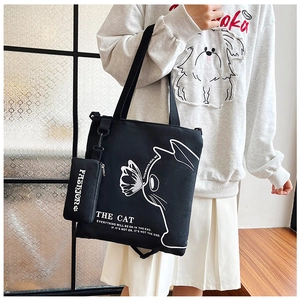Black canvas tote bag with cat graphic and matching mini pouch for daily casual use