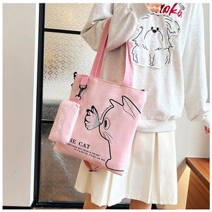 Pink canvas tote bag with cat pattern detail and matching small coin purse for women