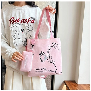 Pink canvas tote bag with cat graphic and small zipper pouch for casual daily use