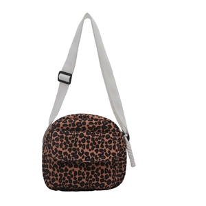 Leopard print canvas crossbody bag with adjustable wide strap and front flap pocket
