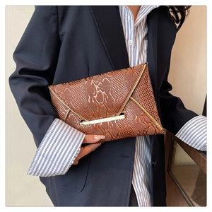 Elegant brown snakeskin embossed envelope clutch with V-shaped gold metal trim detail
