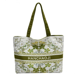 Grand sac cabas en toile à fleurs avec poignées vertes et imprimé lys sur fond blanc