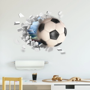 3D soccer ball wall decal bursting through a cracked wall in a kid bedroom setting