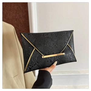 Elegant black envelope clutch with textured crocodile embossing and gold metal trim hardware