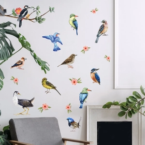 Detailed view of watercolor bird and flower wall stickers in a modern living room setup