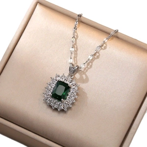 Elegant emerald-green square zircon pendant necklace on a gold silk display box