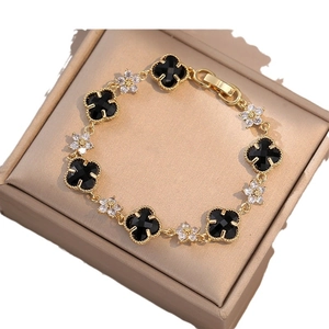 Gold emerald four-leaf clover bracelet with zircon flower charms for elegant women