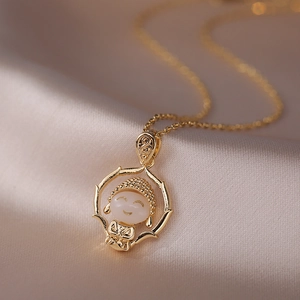 Golden titanium steel necklace featuring a cute cartoon Buddha pendant on silk fabric