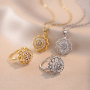 Rotating sunflower necklace and ring set with zircons in gold and silver plating