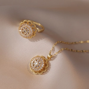 Elegant gold necklace and open ring set with rotating sunflower zircon pendants