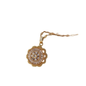 Golden flower pendant necklace with radiant cubic zirconia petals on thin gold chain