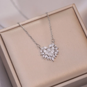 Silver-tone titanium necklace with sparkling zircon heart pendant on luxury gift box