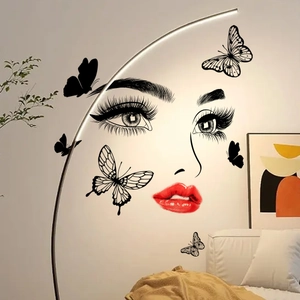 Minimalist wall sticker with female face and butterflies in a stylish living room setting