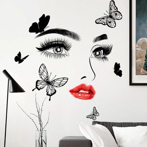 Modern wall sticker featuring female eyes, red lips and black butterflies for living room