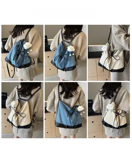 Detail view of canvas backpack with bow decor and plush charm in multi-angle grid