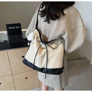 Chic color-block herringbone tote bag with bow detail and plush bear pendant