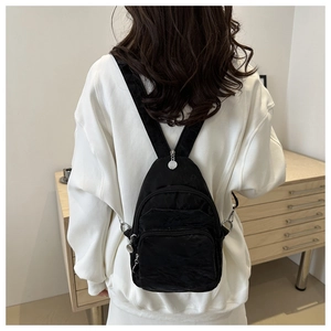 Versatile black nylon mini backpack and crossbody chest bag with multiple zipper pockets