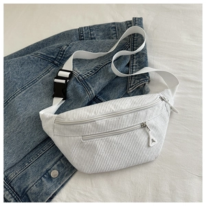 Detailed macro view of white corduroy waist bag texture and high-density strap buckle