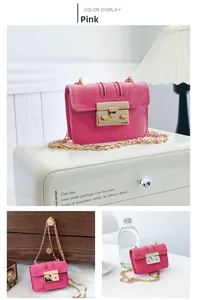Close-up of pink suede mini chain bag with golden metal buckle for daily commute