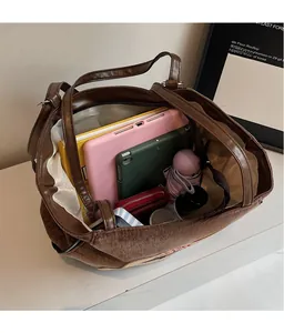 Interior view of large brown tote bag showing ample space for tablets and daily essentials