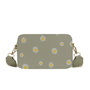 Light green floral square crossbody bag with daisy prints and a wide shoulder strap
