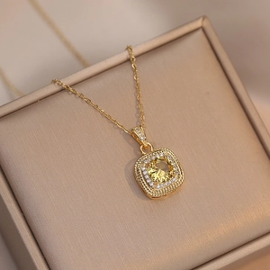 Elegant gold necklace with square yellow crystal pendant and sparkling crystal halo