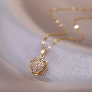 Elegant gold octagonal star pendant necklace with purple and white micro-pave zircons