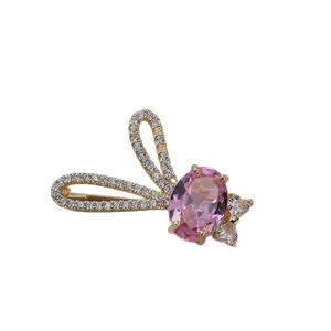 Cute bunny brooch with pink gemstone and white crystals on a gold-plated base