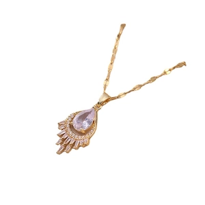 Gold fashion necklace with pink teardrop crystal pendant and baguette zircon accents