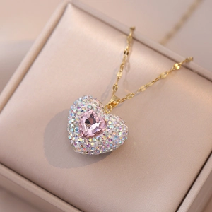 Sparkling pink heart pendant necklace with colorful crystals on a gold chain