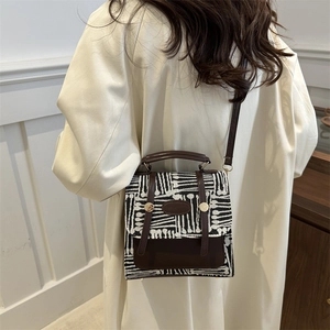 Vintage plaid contrast crossbody bag with brown leather accents and gold hardware
