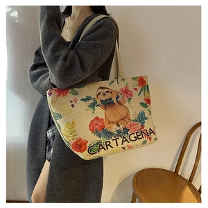 Ethnic floral canvas tote bag with tropical sloth print and Cartagena text on shoulder strap