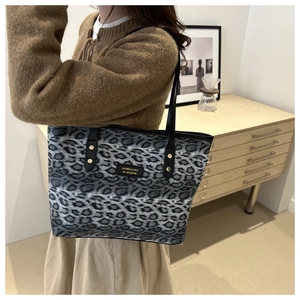 Chic grey leopard print tote bag for women with black straps and metal brand plate