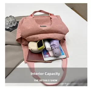 Internal capacity of pink corduroy tote bag showing tablet and daily essentials