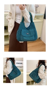 Detail of corduroy tote bag featuring front flap pocket and textured fabric finish