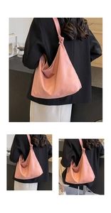 Rear view of a pink minimalist soft leather hobo bag with unique knotted strap detail