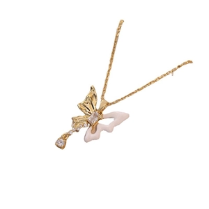 Elegant gold butterfly necklace with zircon tassels on a clean white background