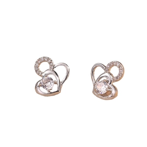 Elegant heart-shaped silver earrings featuring sparkling cubic zirconia on white background