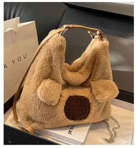 Close-up of brown plush faux fur bag with 3D animal ears and leather chain straps