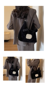 Detail showing plush black cartoon shoulder bag with cute ears and soft faux fur texture